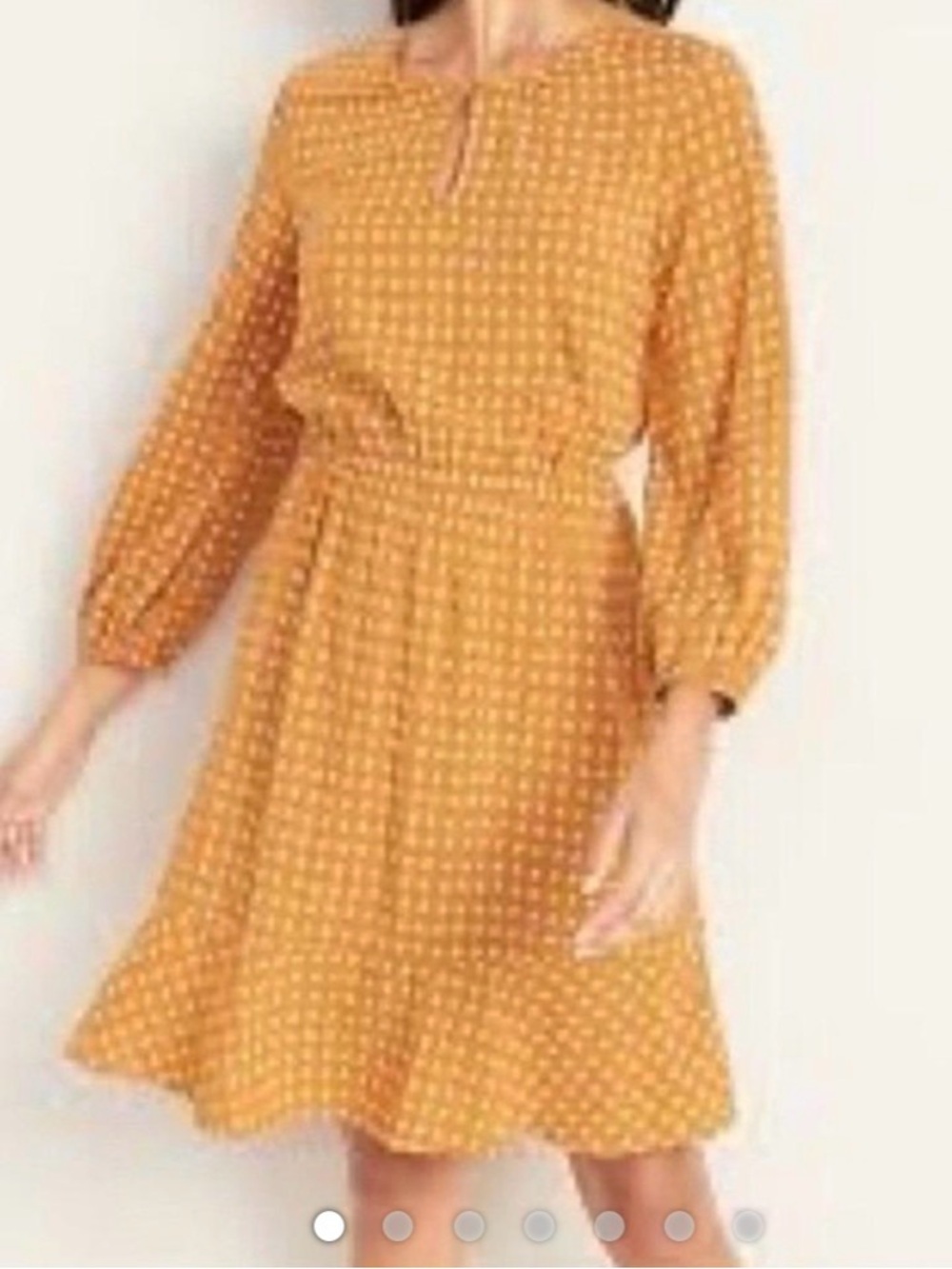 Waist-defined Keyhole dress in yellow.